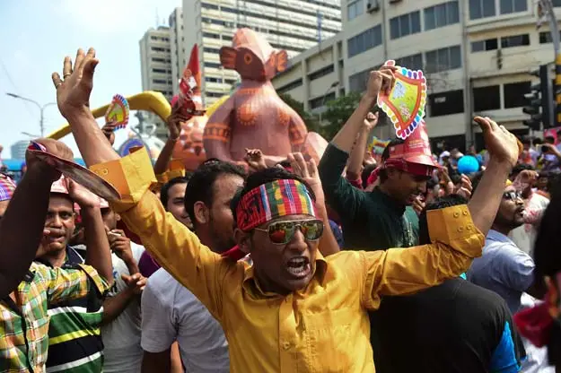 Revellers attend a rally in celebration of the Bengali New Year or Pohela Boishakh in Dhaka on April 14, 2016. PHOTO: AFP